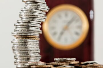 selective focus photo of stacked coins